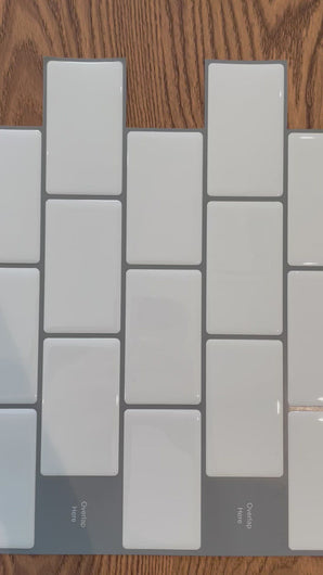 close up video on white and grey stick on tile 