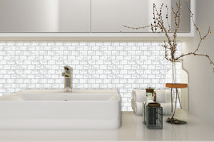 marble peel and stick tile in the bathroom as splashback