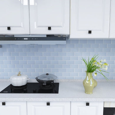 soft blue subway stick on tiles against an all white kitchen