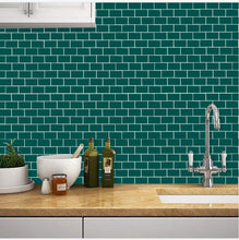 Load image into Gallery viewer, Forest green subway peel and stick tile in the kitchen against an elegant tap
