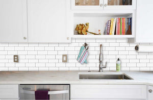 realistic classic white subway stick on tiles with dark grey grout as kitchen splashback behind tap 