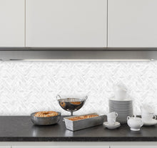 Load image into Gallery viewer, marble herringbone sticky tile in the kitchen as splashback against white cabinetry
