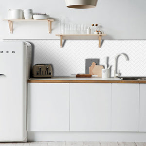 white herringbone peel and stick tile with white grout in a caravan kitchen in australia
