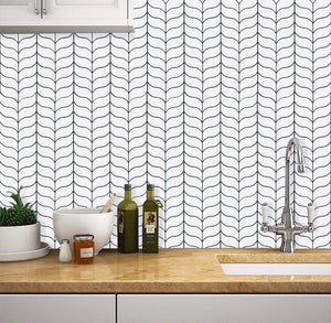 whales tail peel and stick tiles in the kitchen as splashback with elegant tap